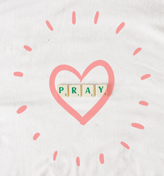 How to help your kids fall in love with prayer blog post - Picture of Scrabble tiles spelling out "pray" with a pink heart around the letters.